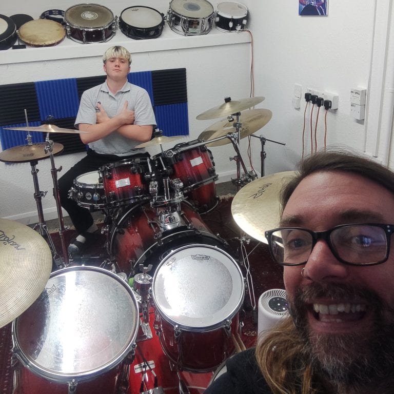 Drum Lessons @ Tricks with Sticks Falmouth Boy having a drum lesson in Tricks with Sticks studio